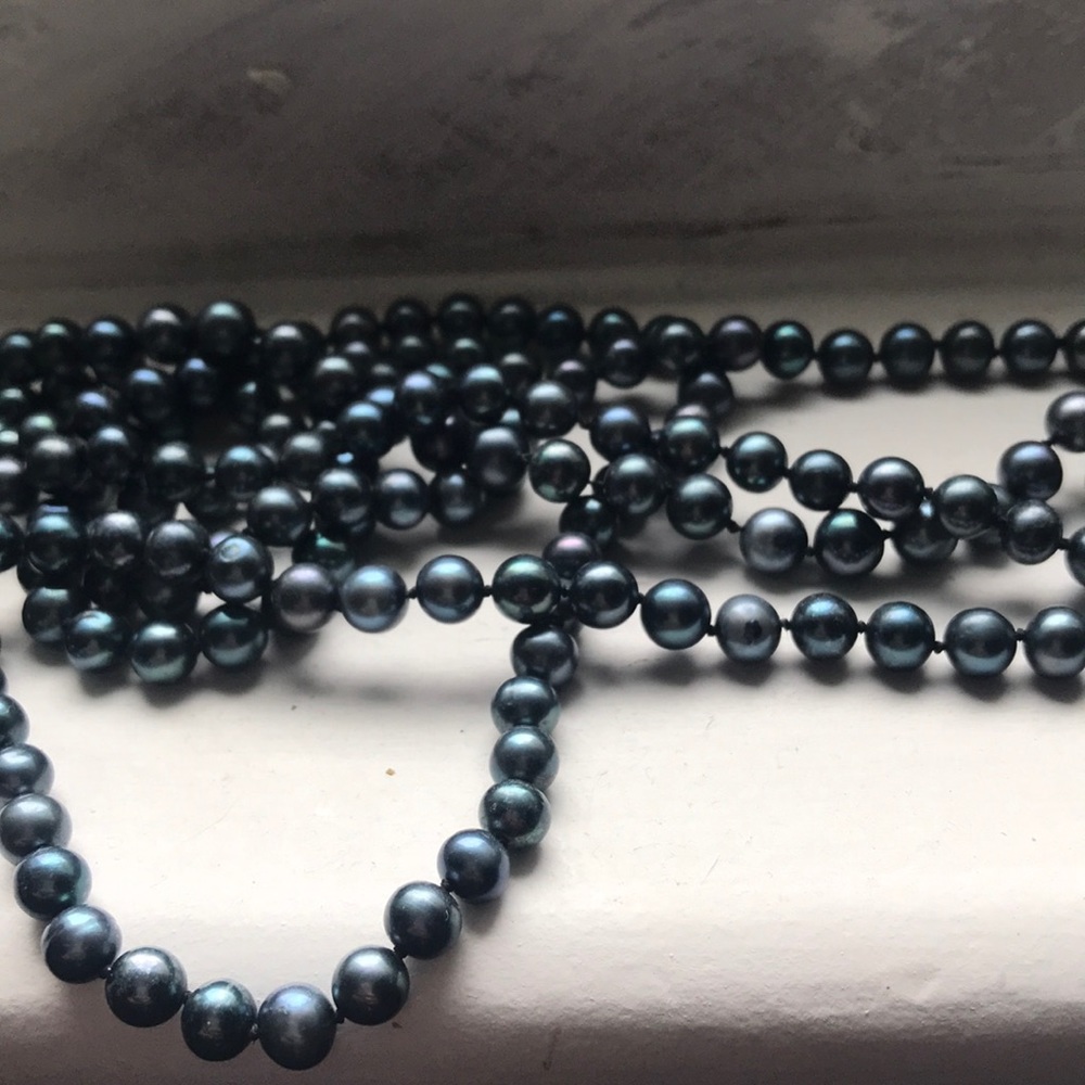strand of dark blue pearls and matching bracelet